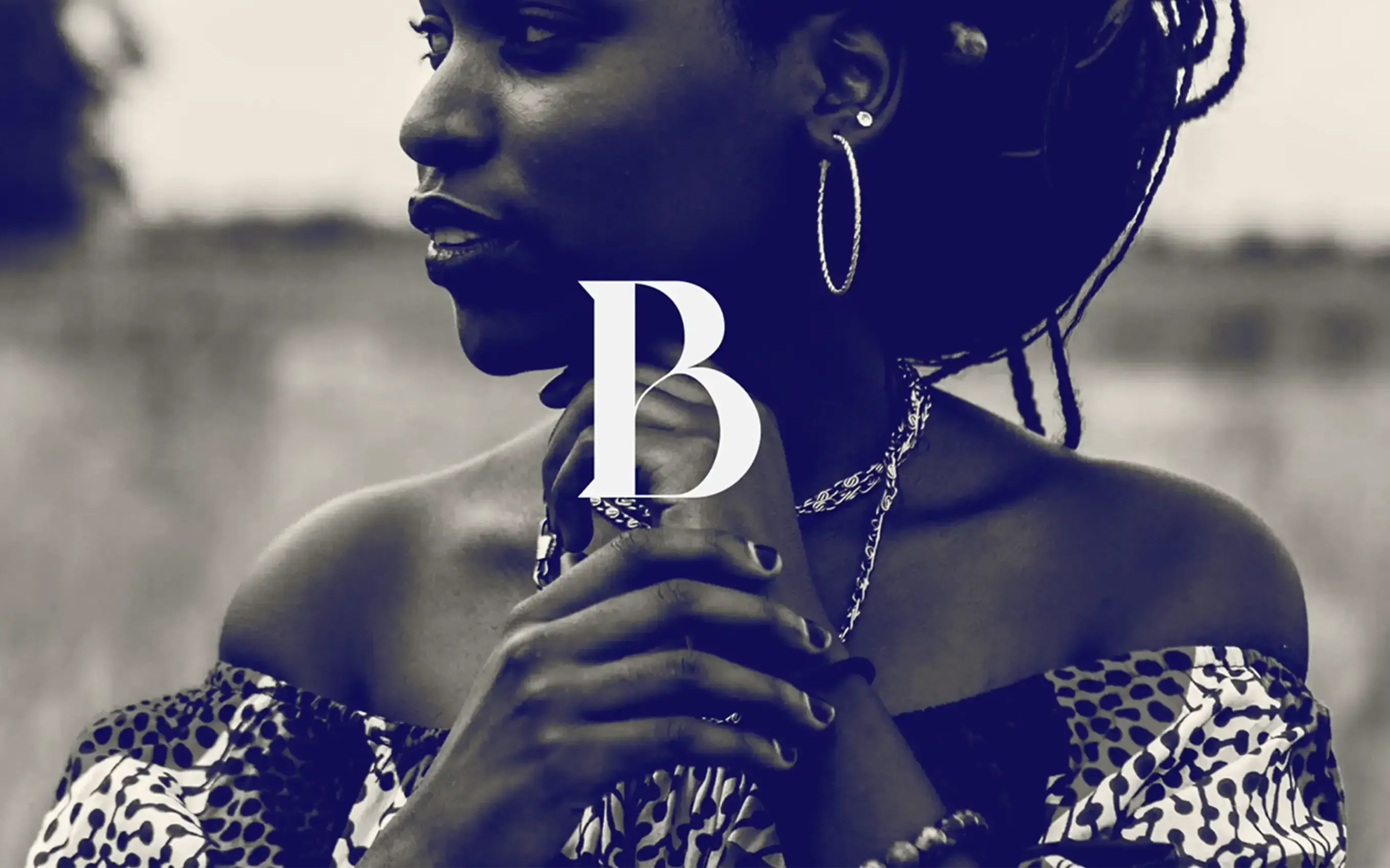 Black and white portrait with the Backstory “B” mark